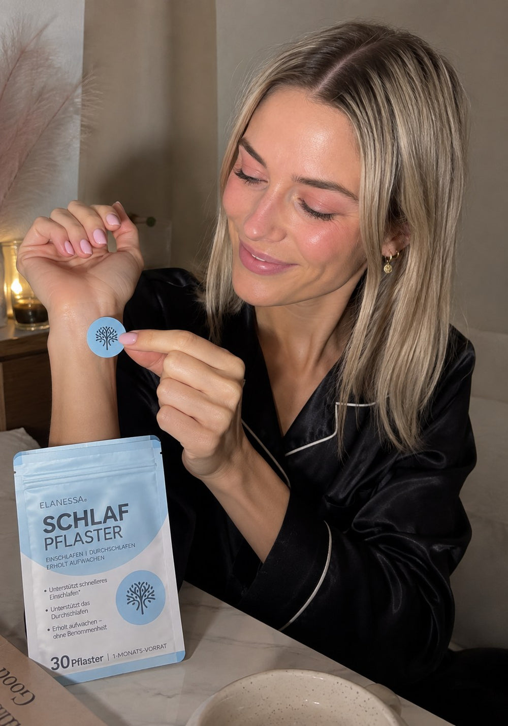 A customer holding a single Elanessa Sleep patch.