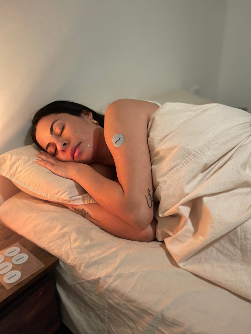 A customer asleep wearing a Sleep patch.